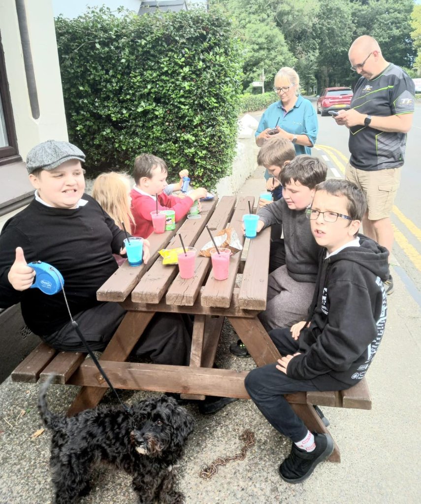 Scouts having a snack break outdoors