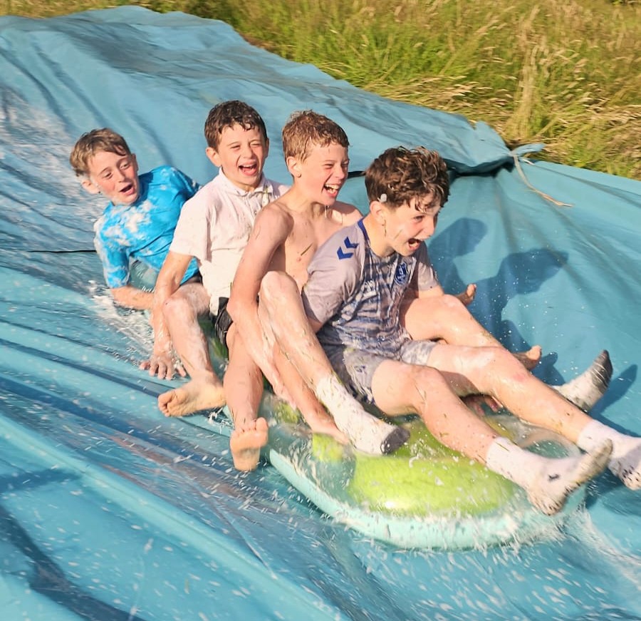 Scout on a slip and slide