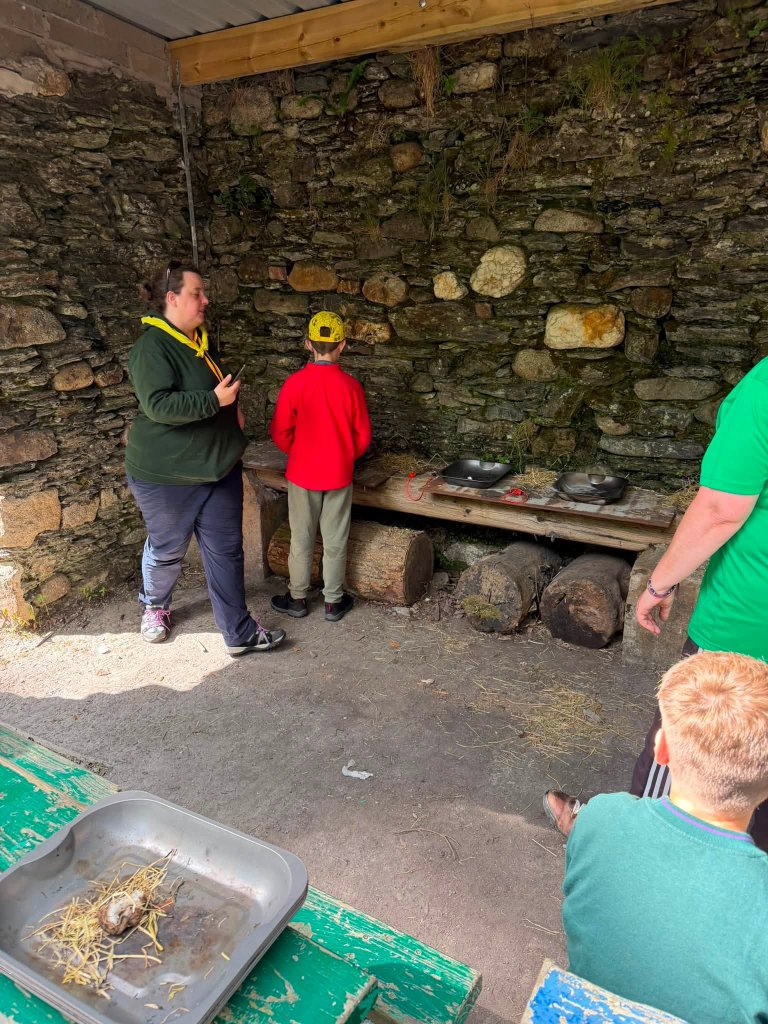 Scouts at an outdoor camp shelter