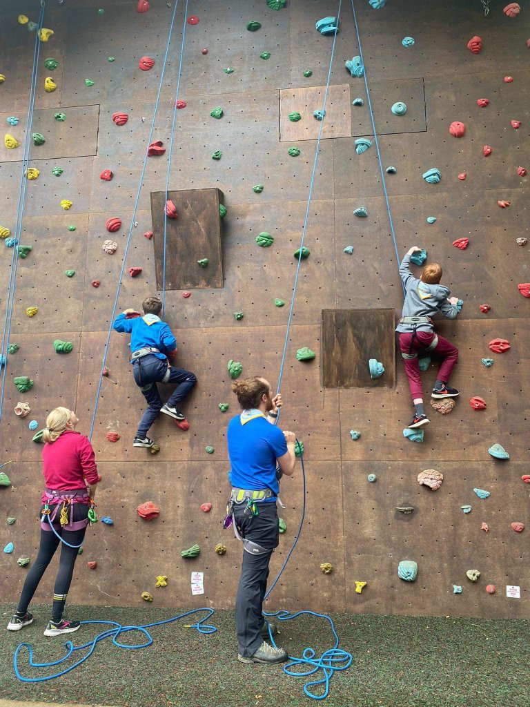 Scouts climbing wall outdoors
