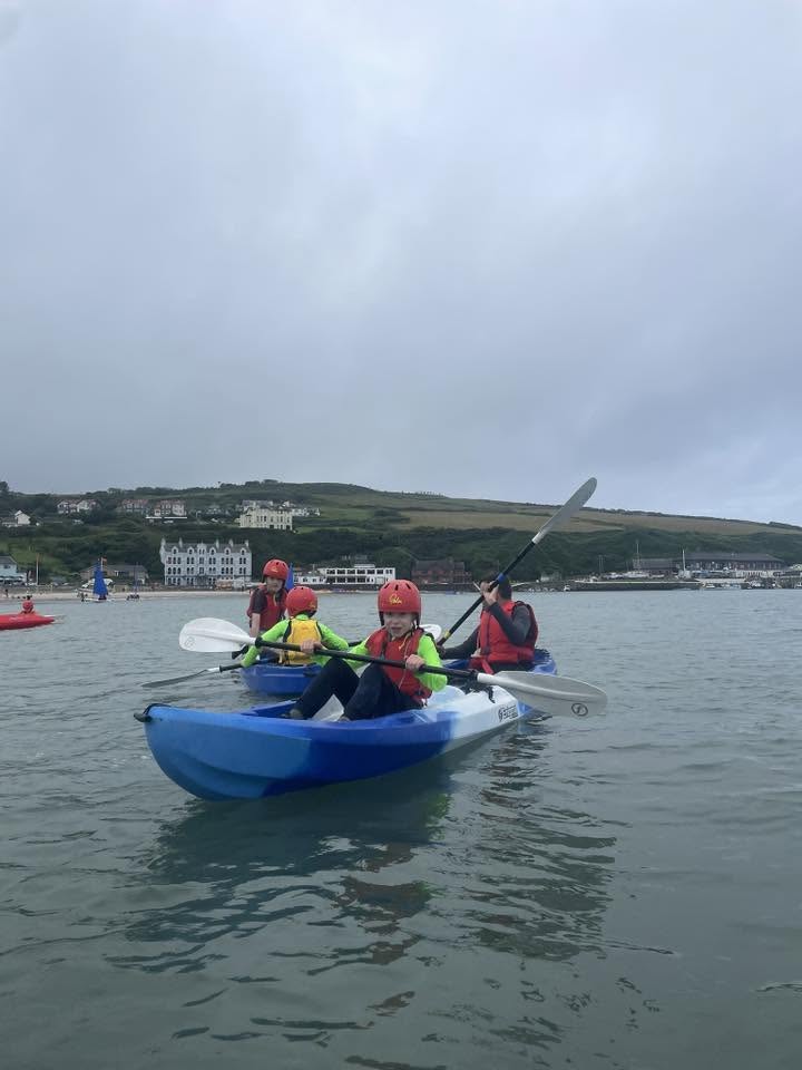 Scouts tandem kayaking together
