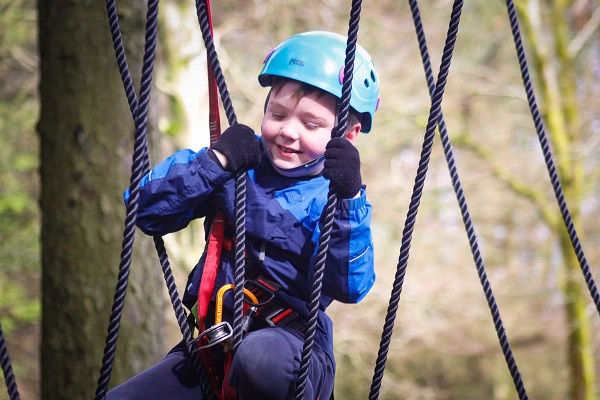 Scout on a high ropes course
