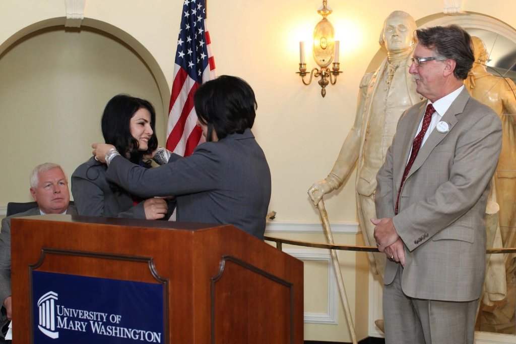 Alaha speaking at event