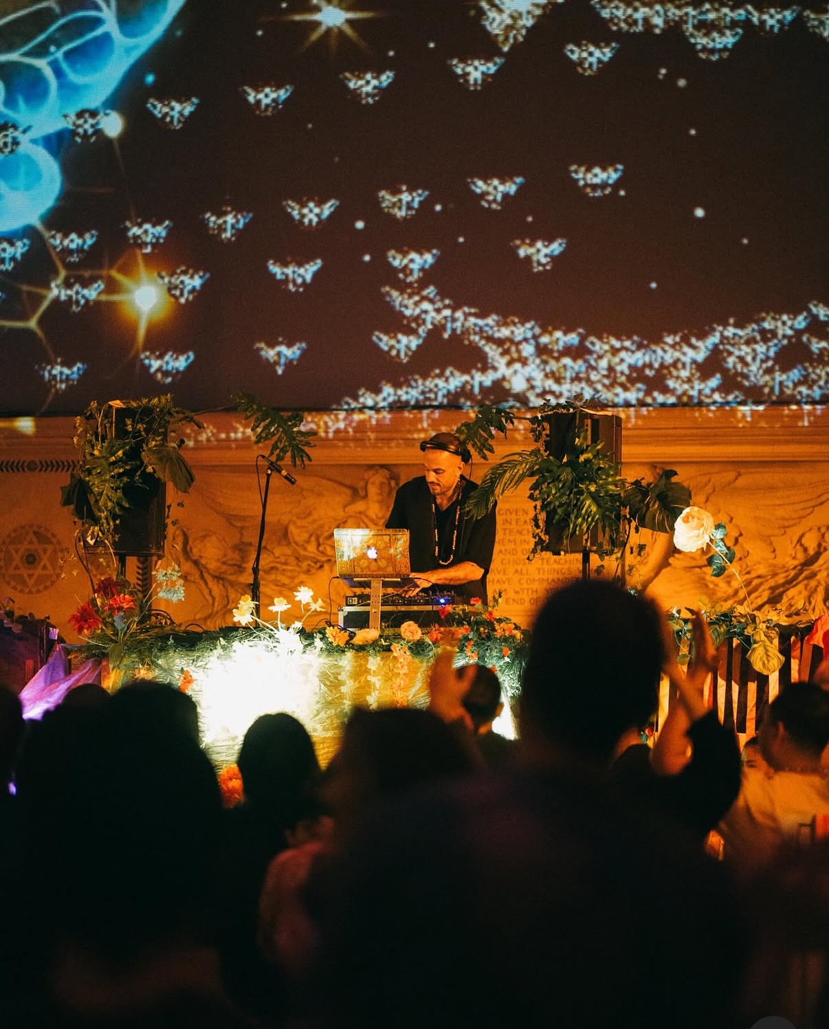 DJ spinning at an ecstatic dance event