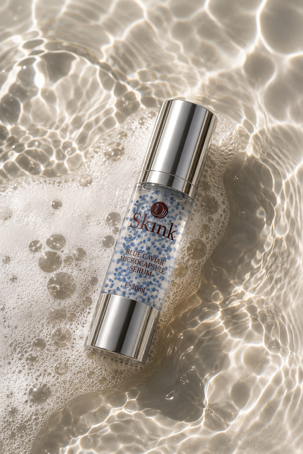 SKINK Blue Caviar Microcapsule Serum reposando en agua con espuma