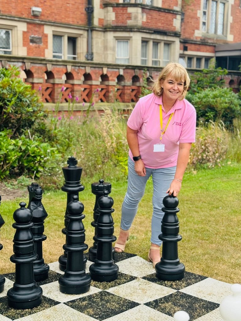 Carole on outdoor chess set