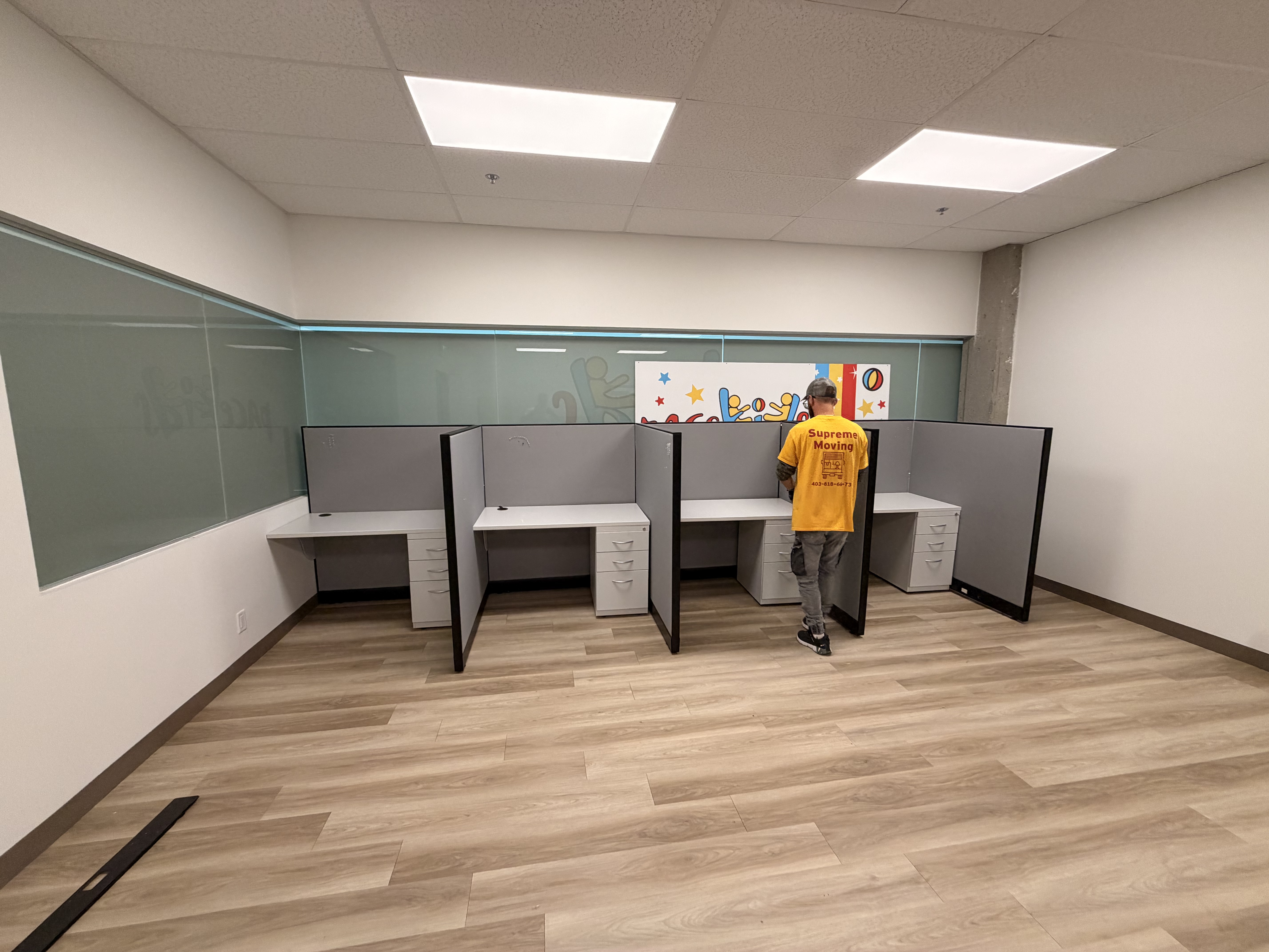Row of cubicle desks installed and ready
