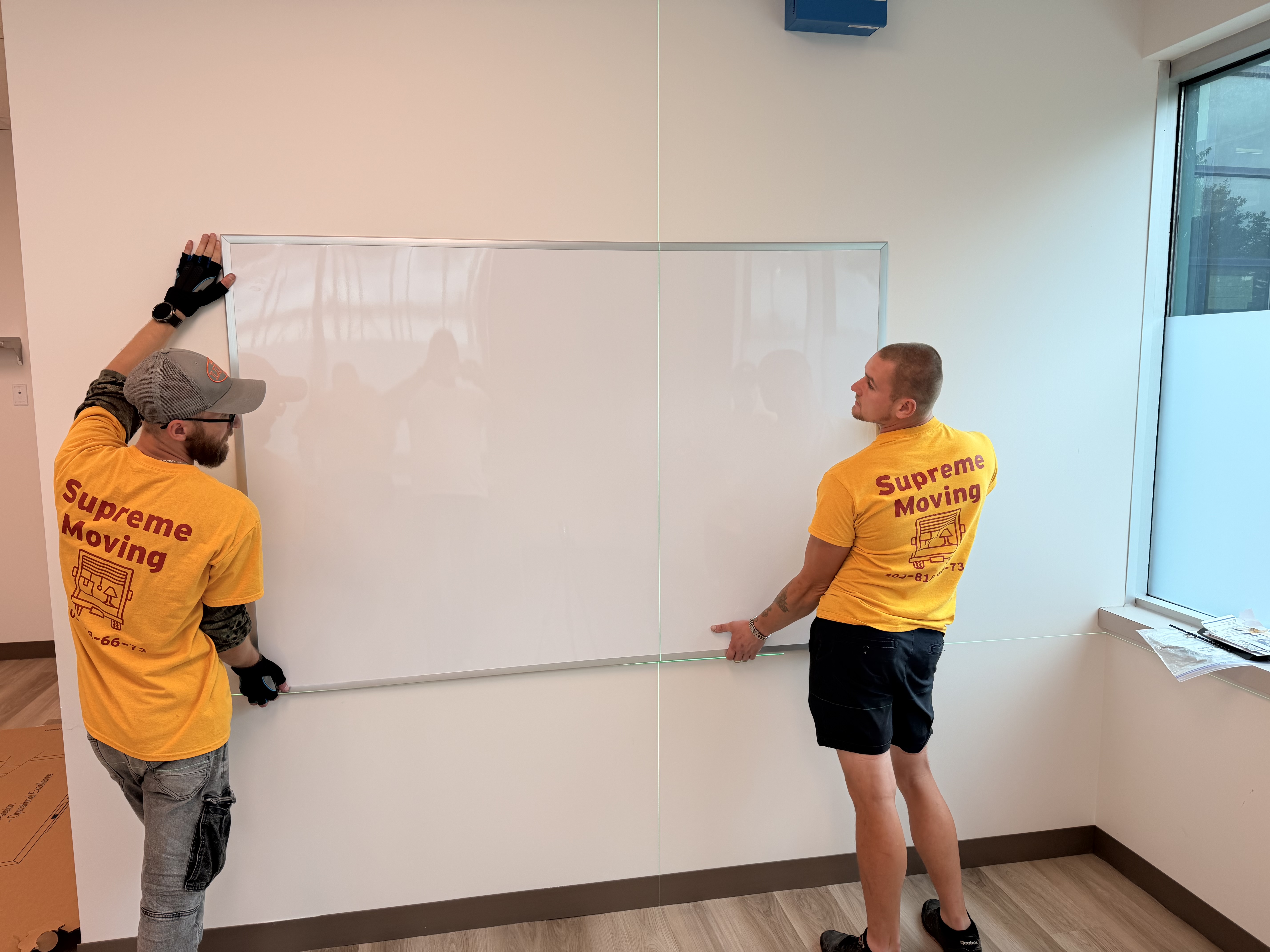 Installing a whiteboard with laser-level precision