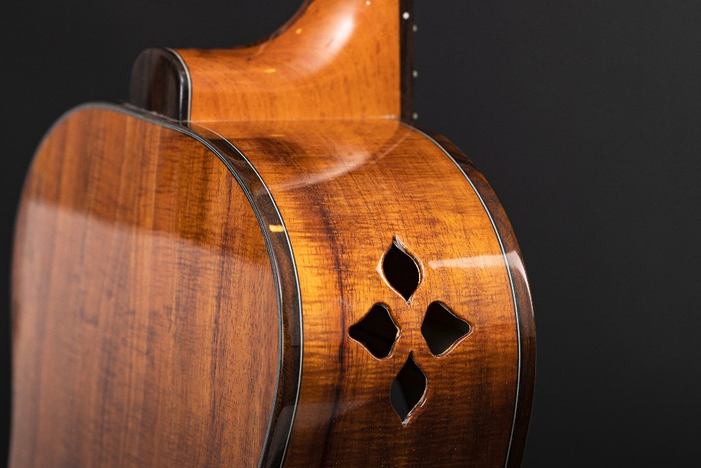 Handmade acoustic guitar sides in koa with diamond-shaped side ports
