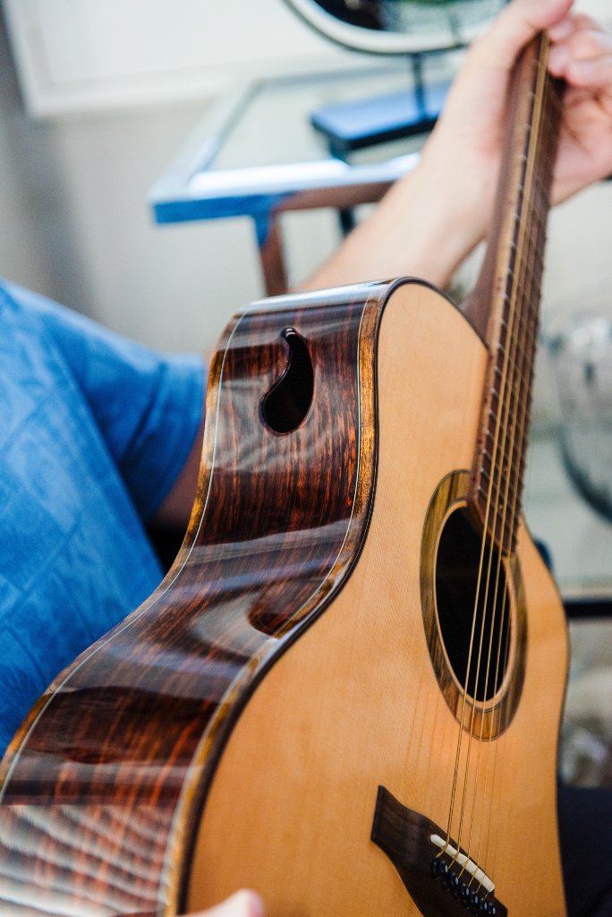 Acoustic guitar side sound port while the guitar is played