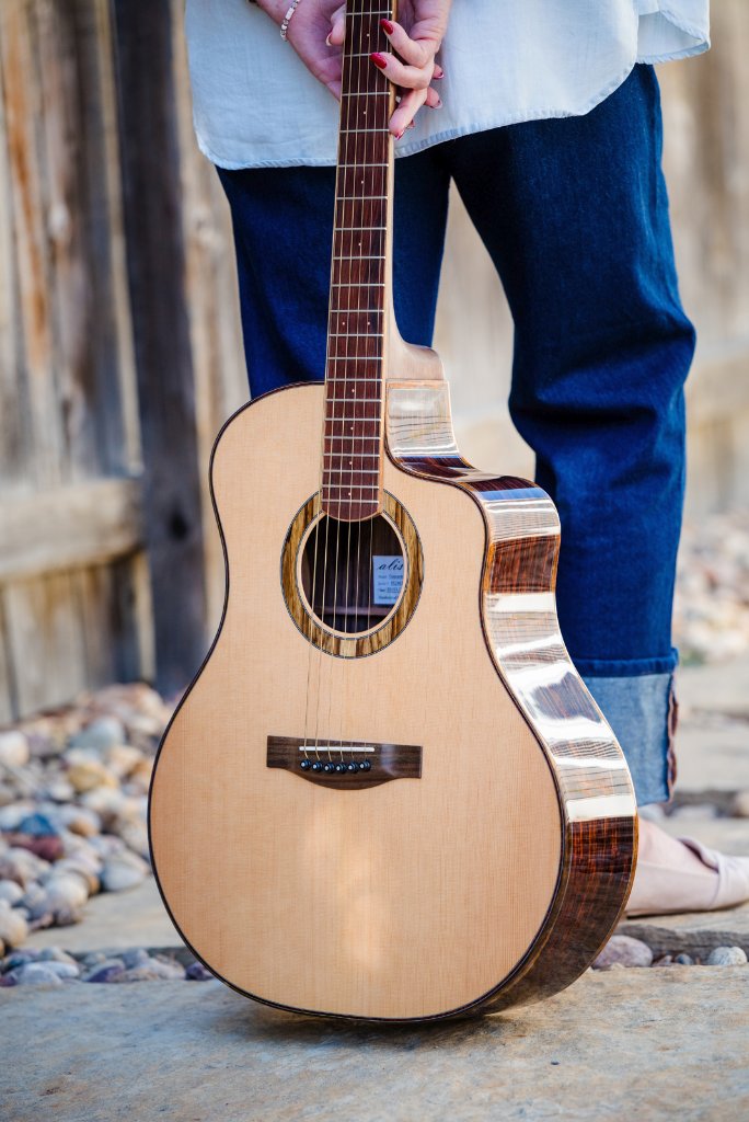 Cutaway grand acoustic guitar photographed outdoors
