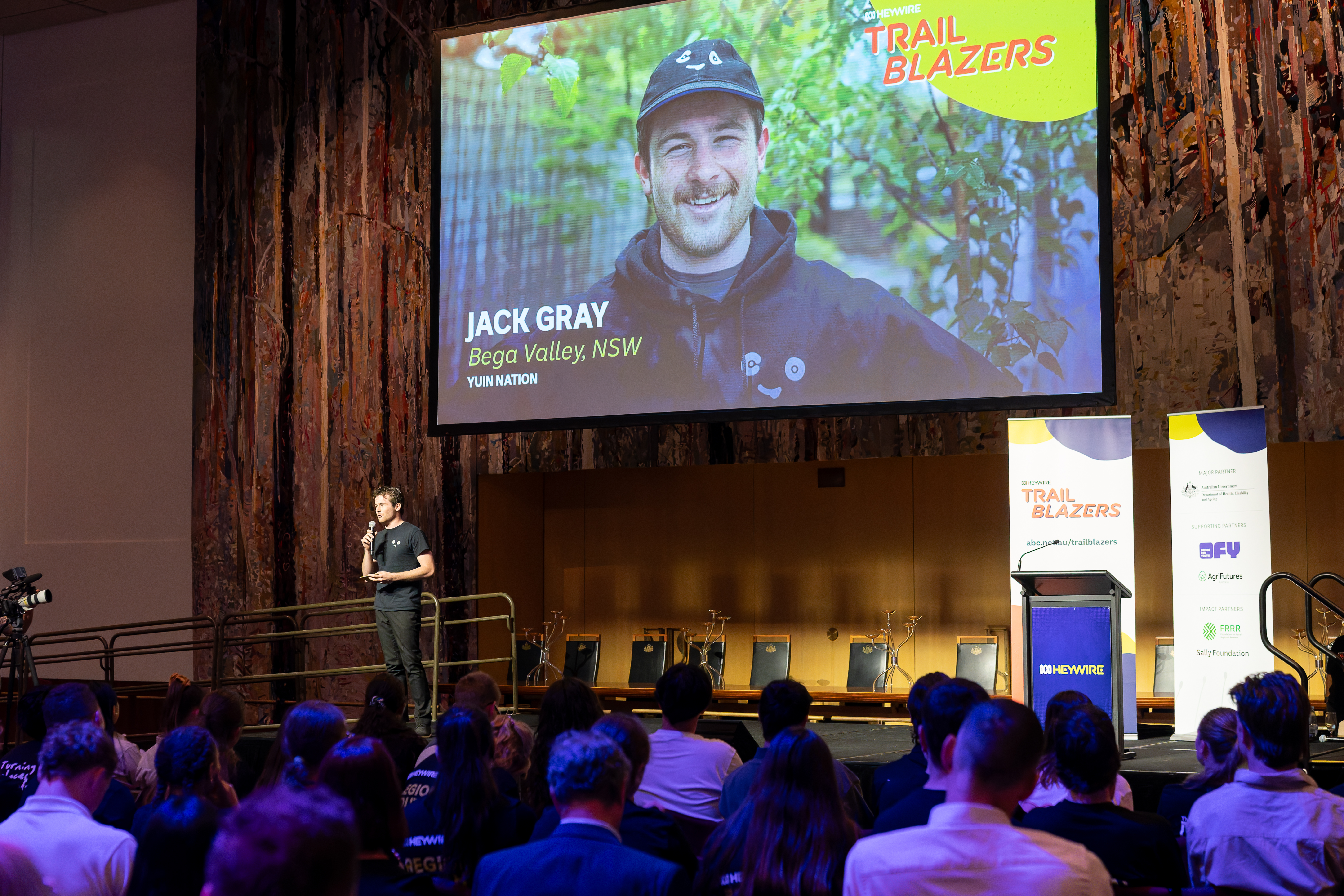 Jack Gray speaking on stage as an ABC Heywire Trailblazer