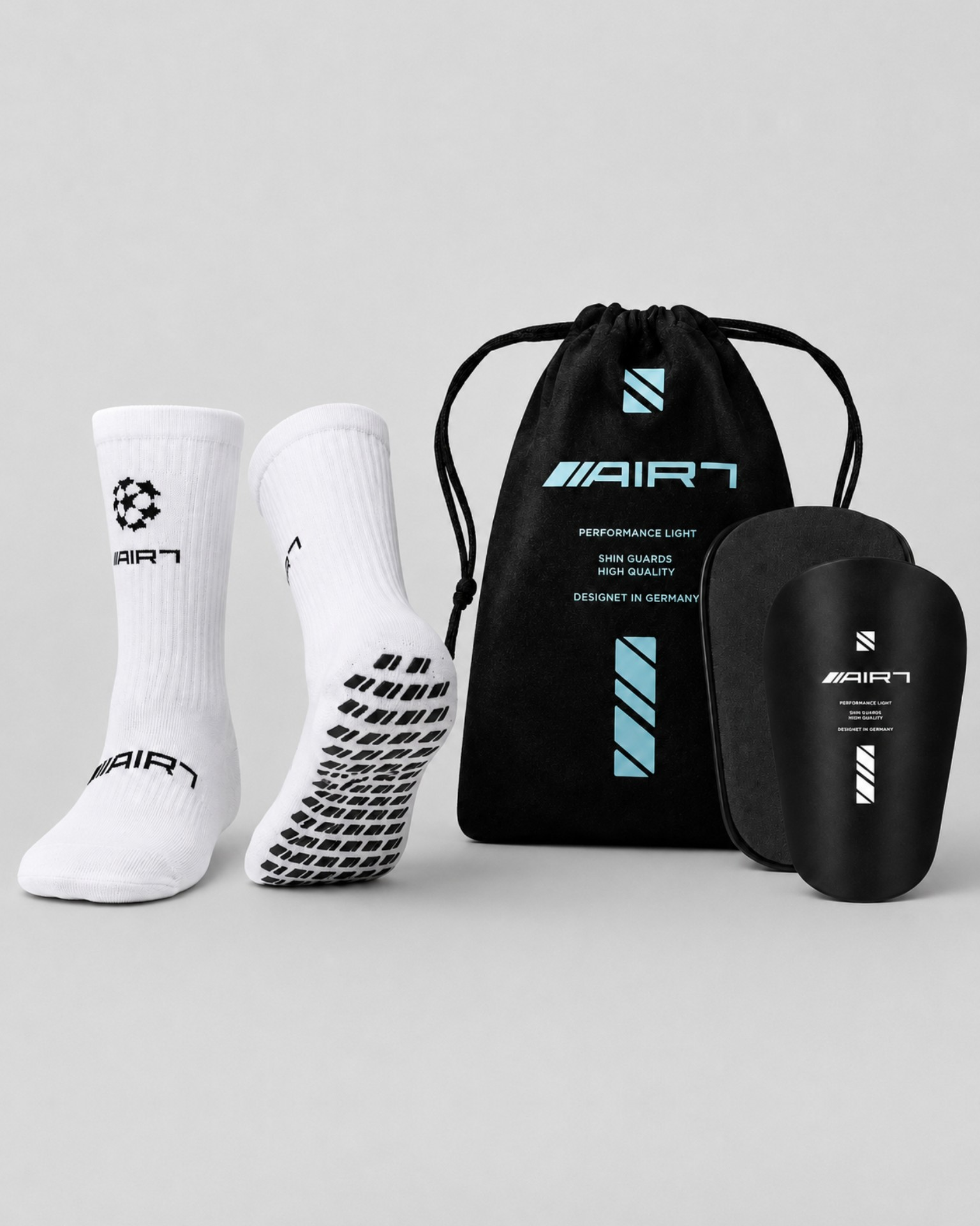 Air7 Pack: Gripsocks White/Black + Shin Guards Black von AIR7
