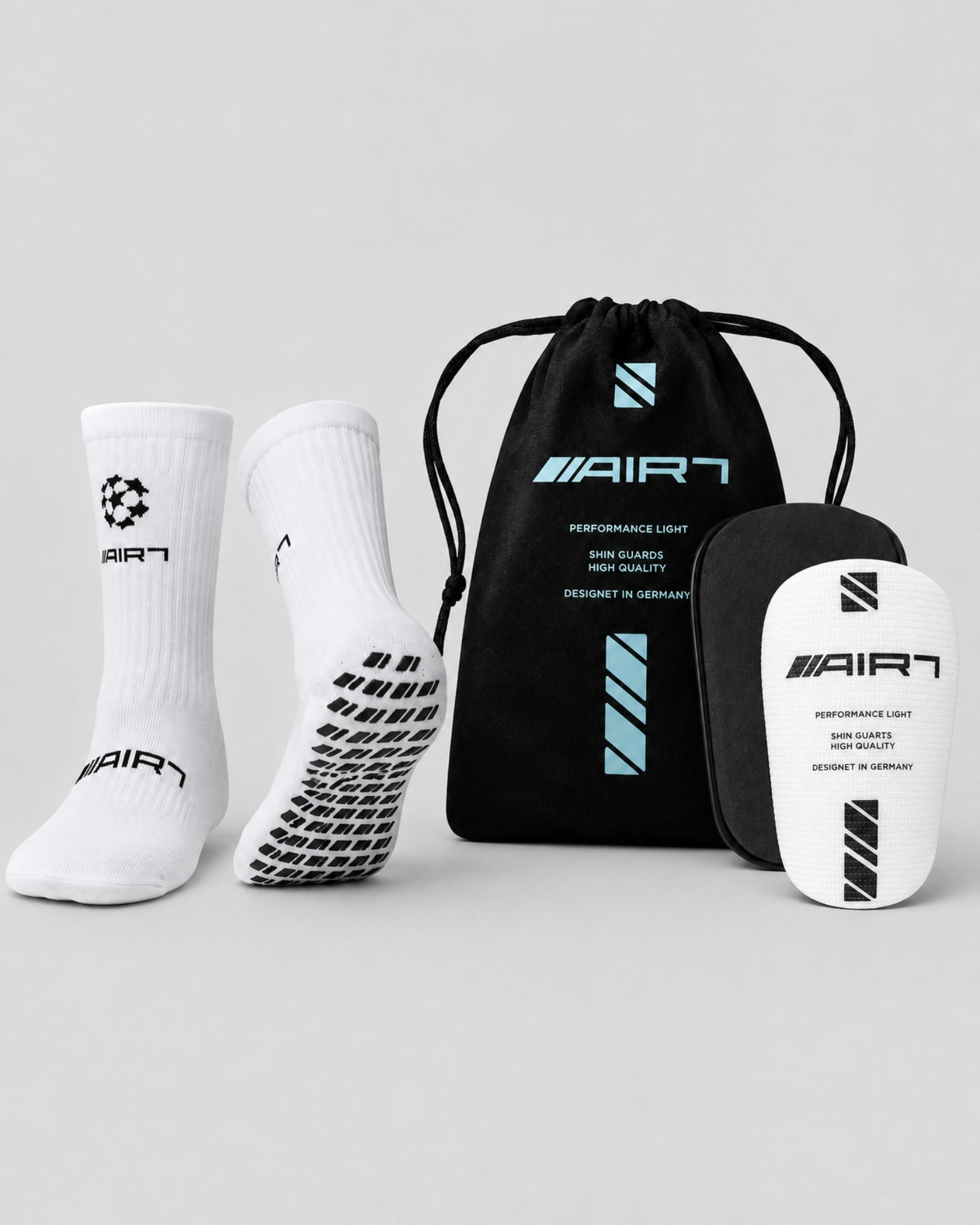 Air7 Pack: Gripsocks White/Black + Shin Guards White von AIR7