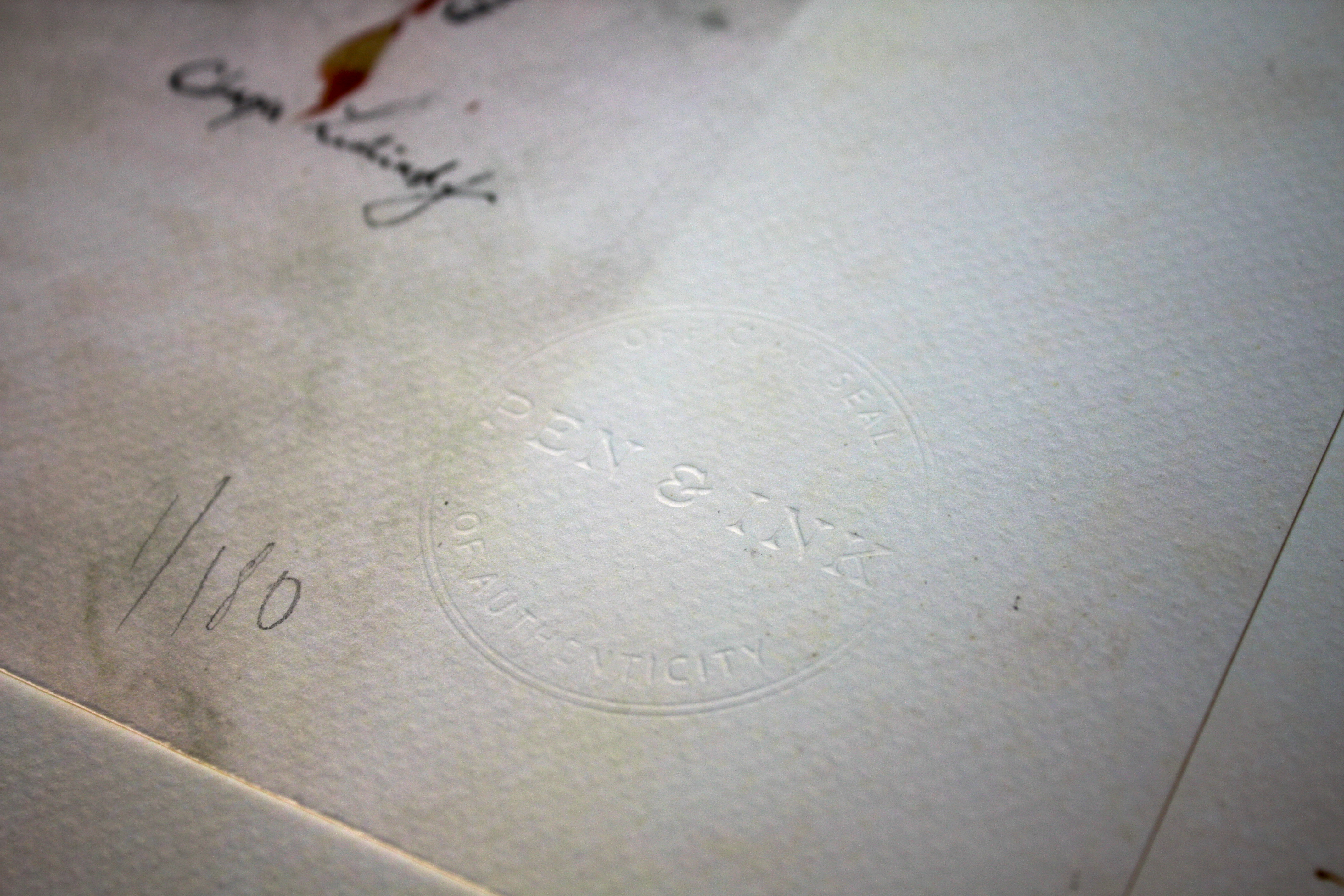 Pen & Ink official embossed seal of authenticity