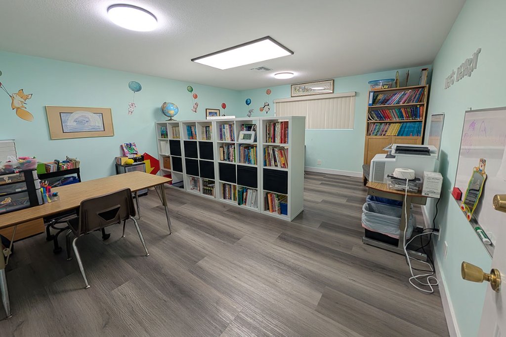 Classroom with murals and bookshelves
