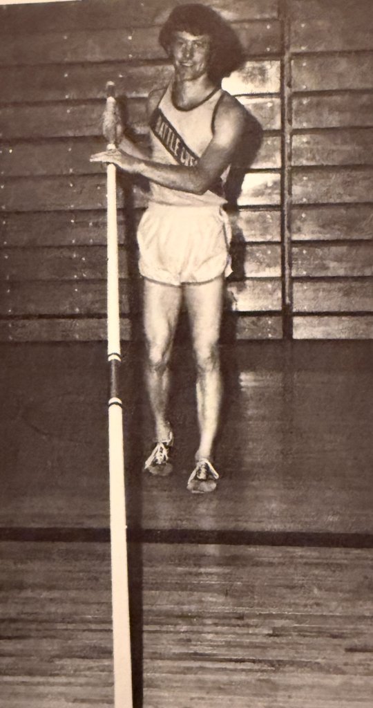 Pole vaulter — "BATTLE CREEK" on the singlet, pole in hand