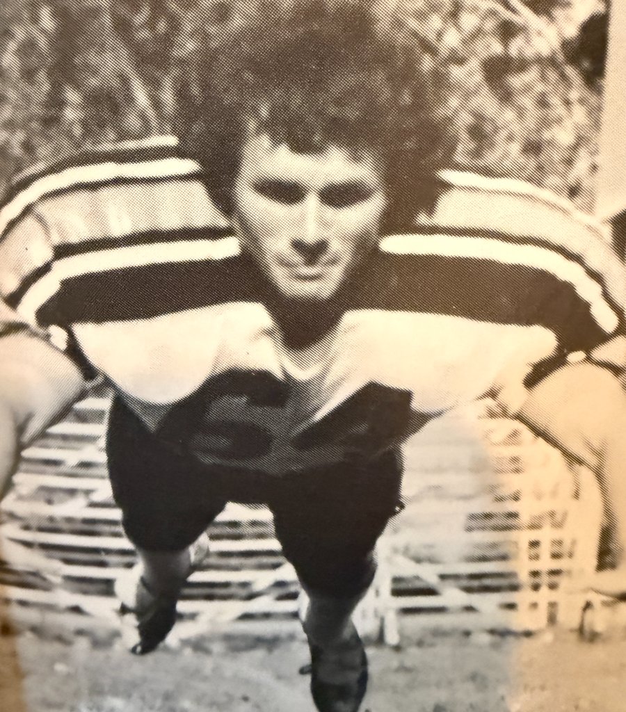 Football — #54 in the three-point stance, ready for the snap