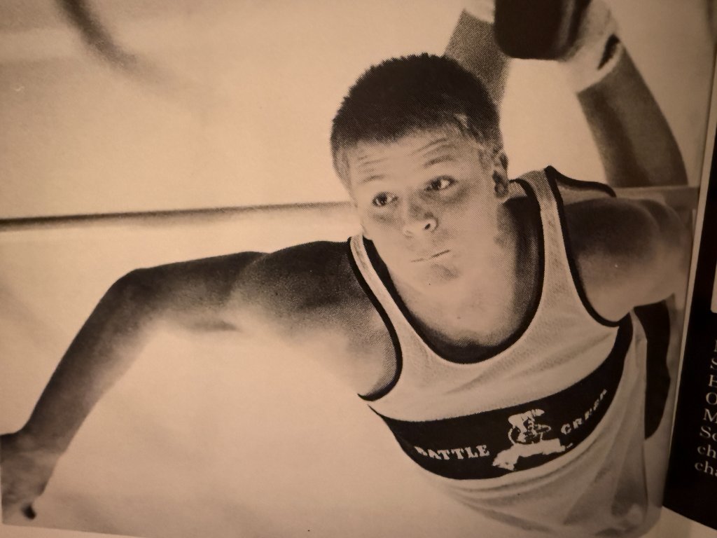 A Brave wrestler — "BATTLE CREEK" across the chest