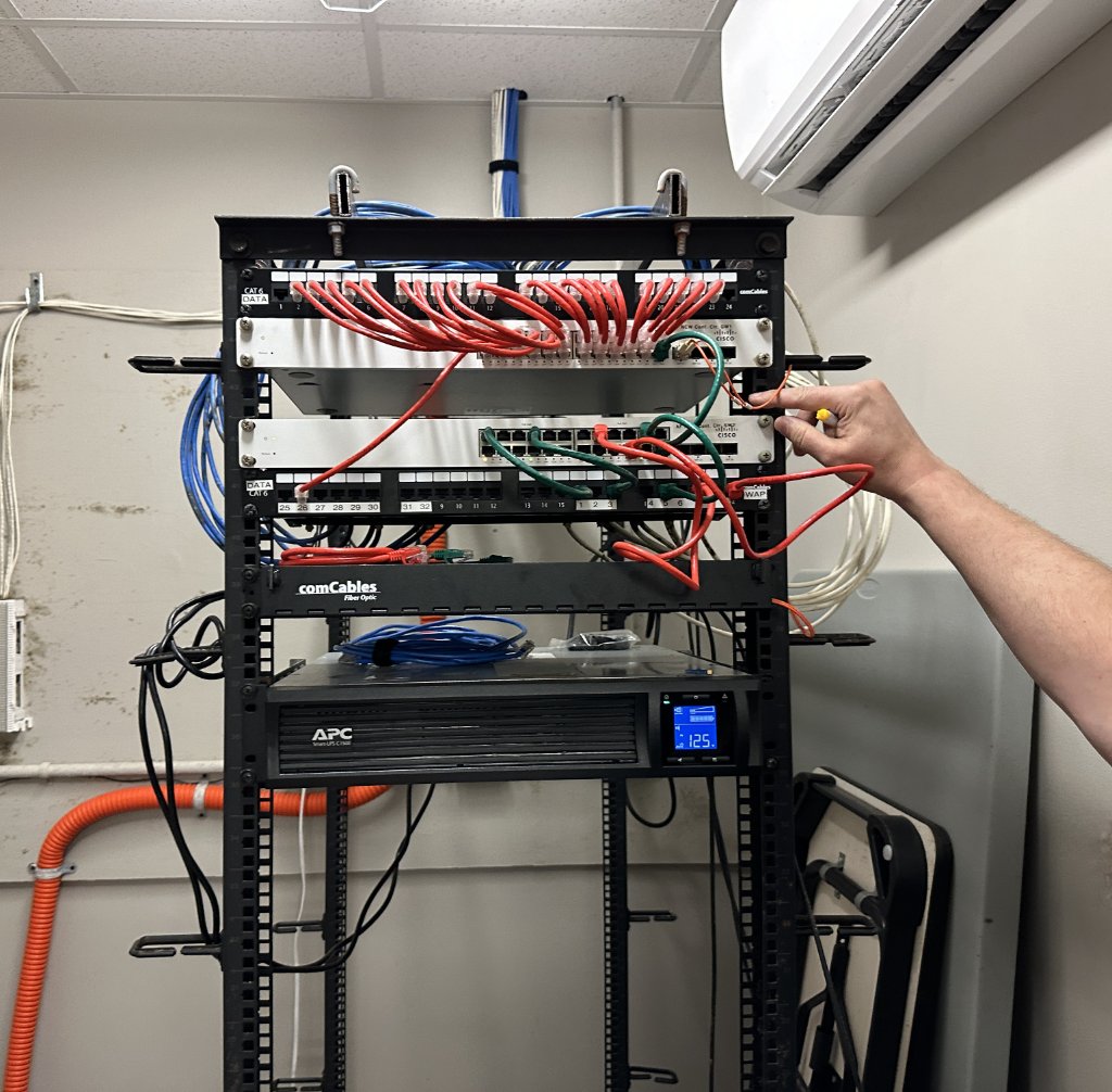 ProMAS technician working on network rack