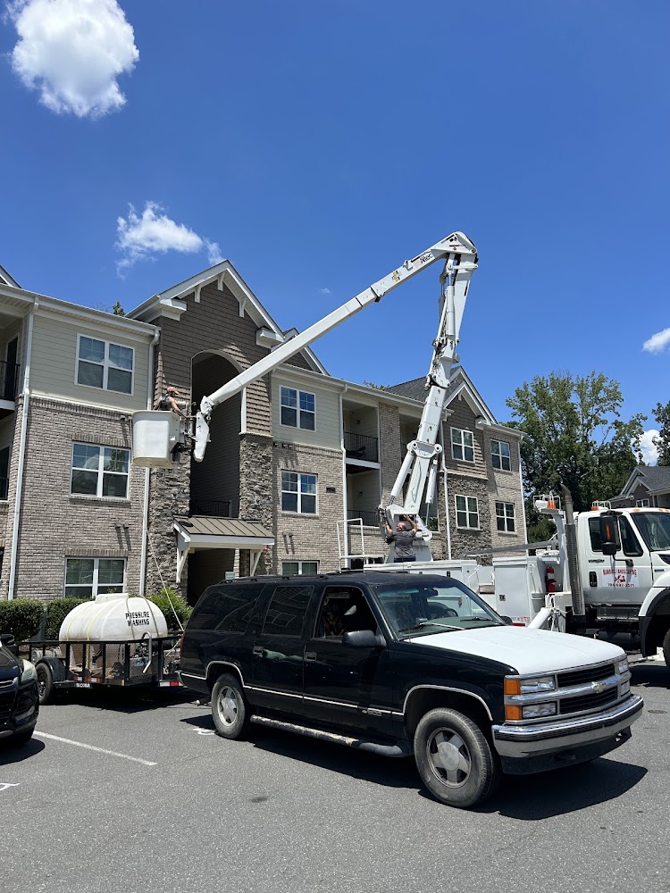 Bucket truck washing a three-story apartment complex near Shelby, NC