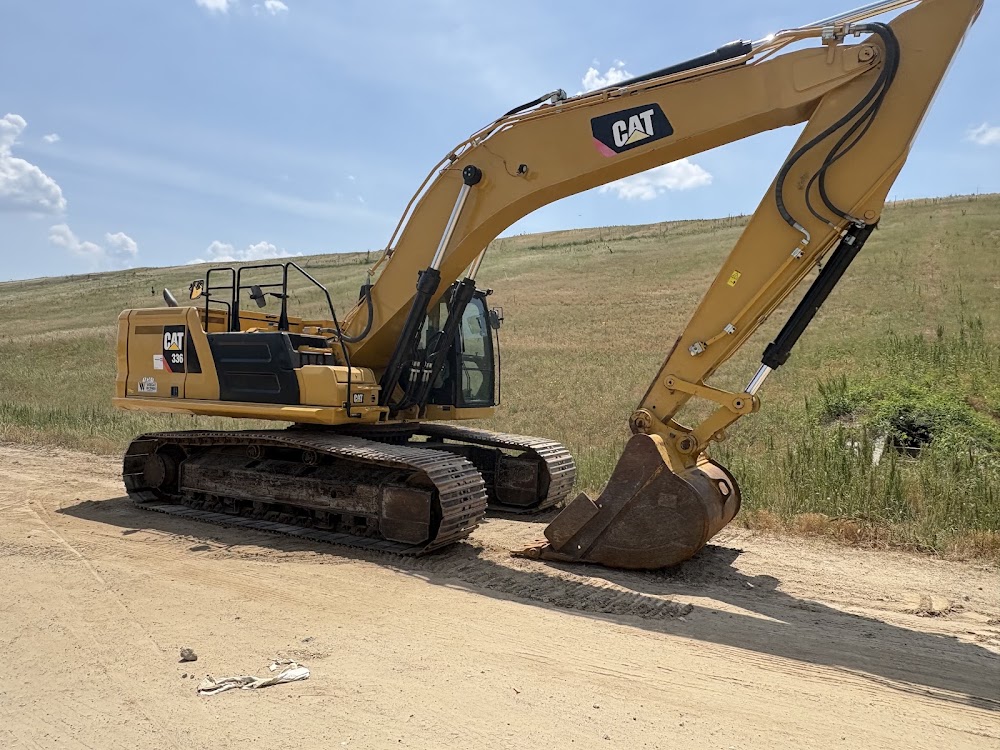 Hydraulic excavator cleaned by Neat Freaks heavy-equipment washing