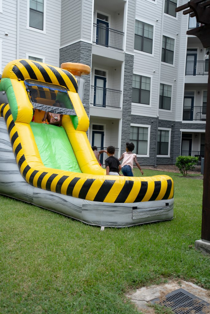 Bounce houses, face painting, a live DJ, and backpacks full of school supplies at The Henry at New Forest 10