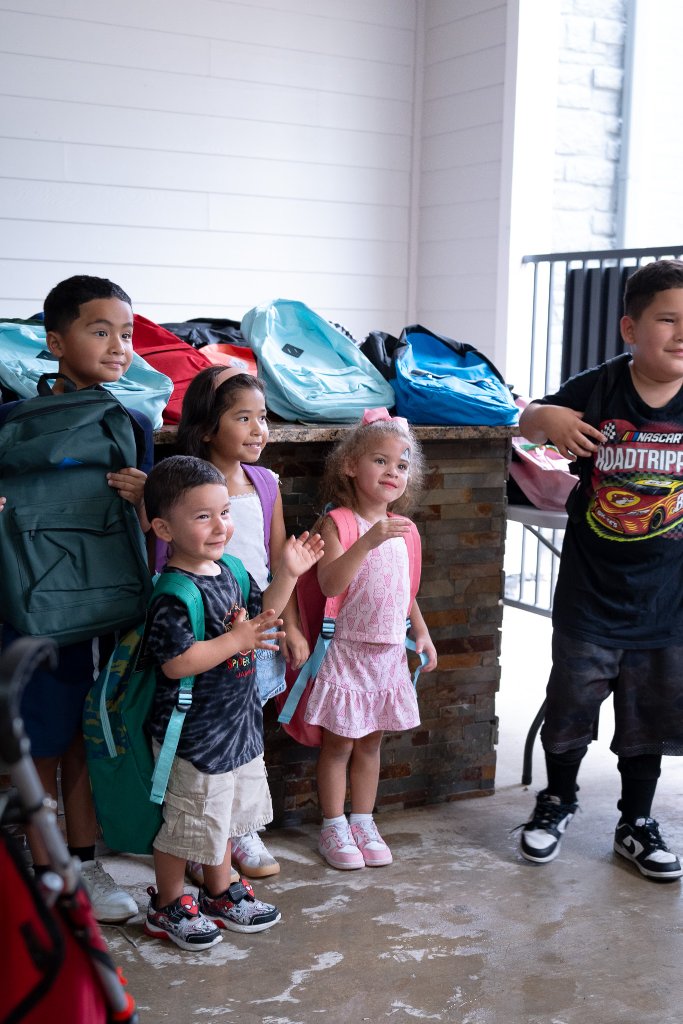 Bounce houses, face painting, a live DJ, and backpacks full of school supplies at The Henry at New Forest 1