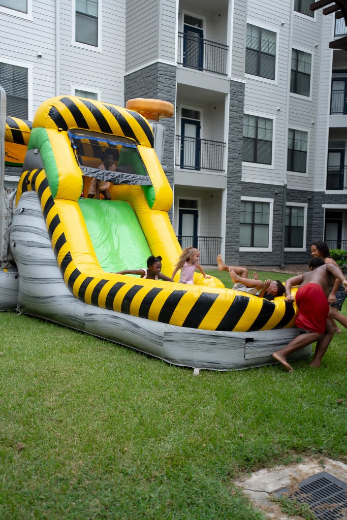 Bounce houses, face painting, a live DJ, and backpacks full of school supplies at The Henry at New Forest 9