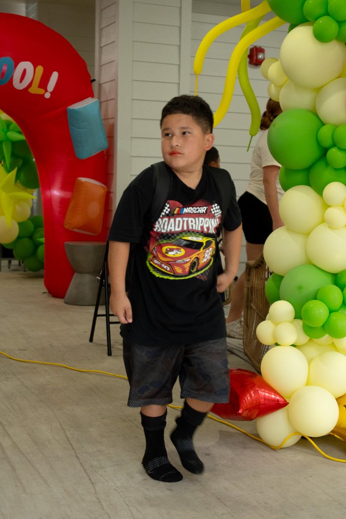 Bounce houses, face painting, a live DJ, and backpacks full of school supplies at The Henry at New Forest 20