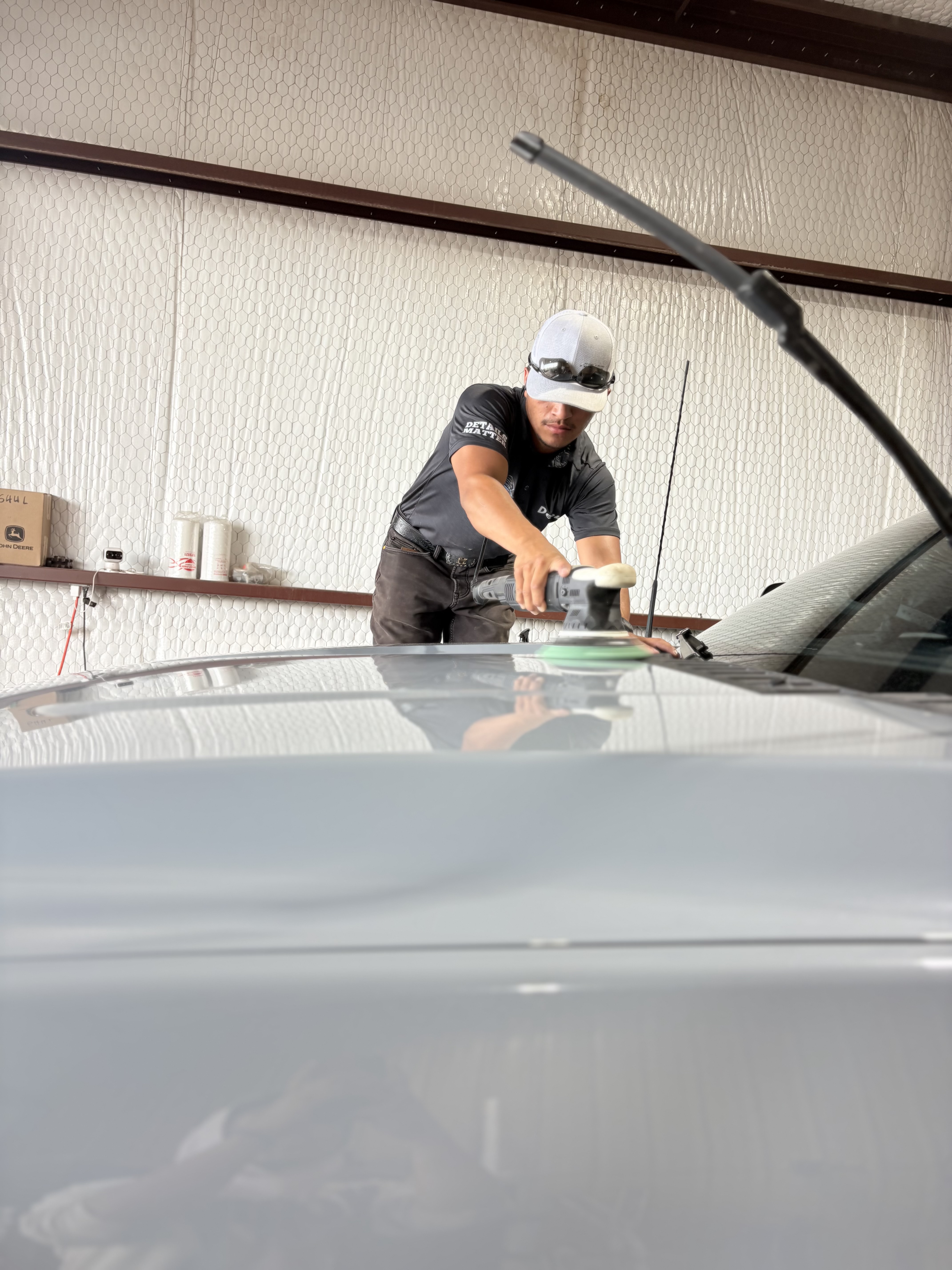 Fine Line Auto Shine polishing a vehicle