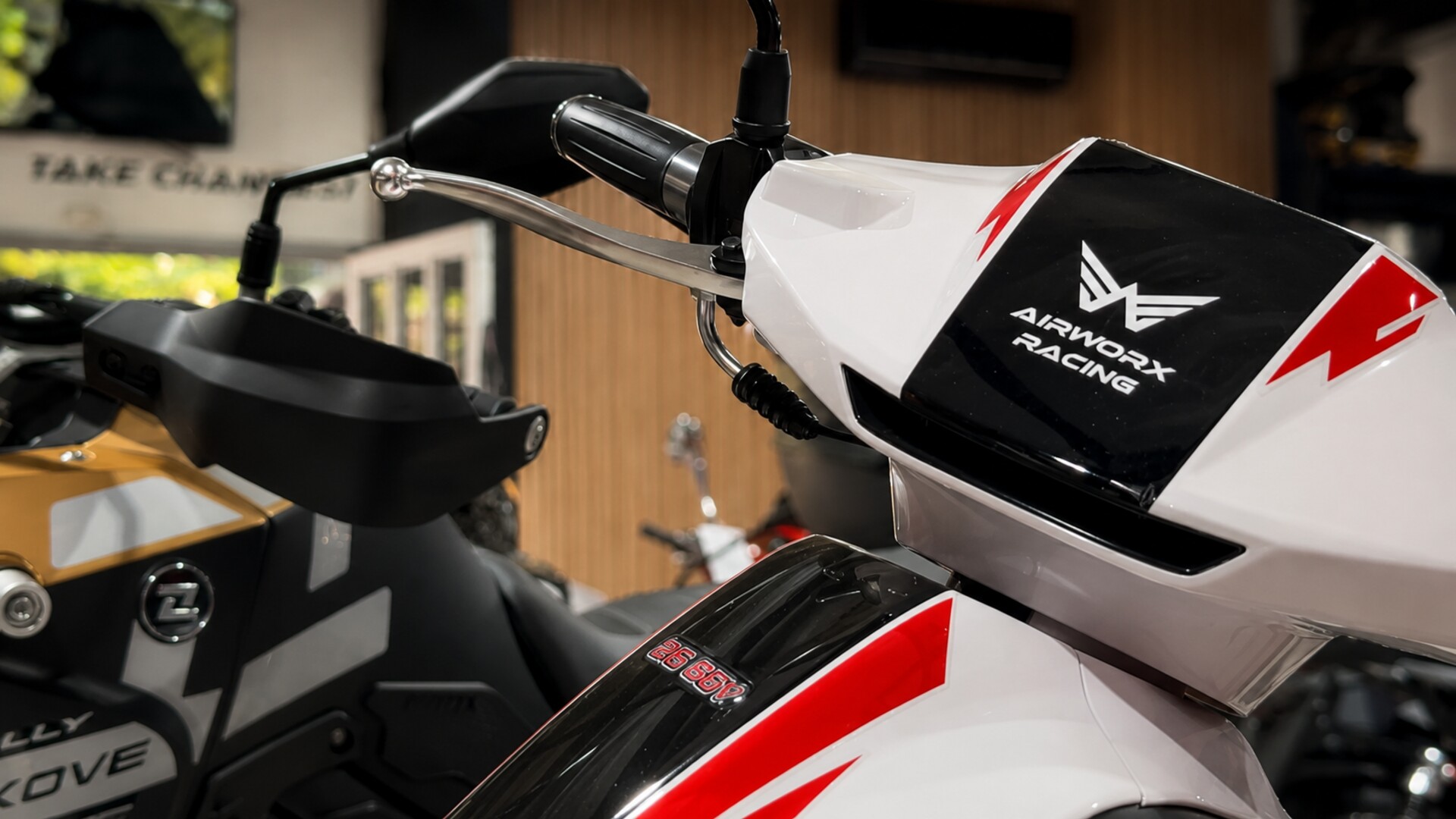 Airworx Racing branding on the tank of a KOVE rally bike in the showroom