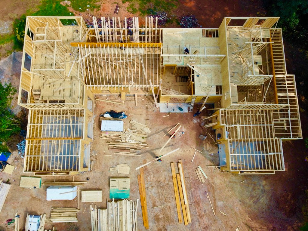 Framing progress at 56 Cooper Lake Rd SW, September 18, 2026 — Overhead view — the scale and room arrangement emerge.