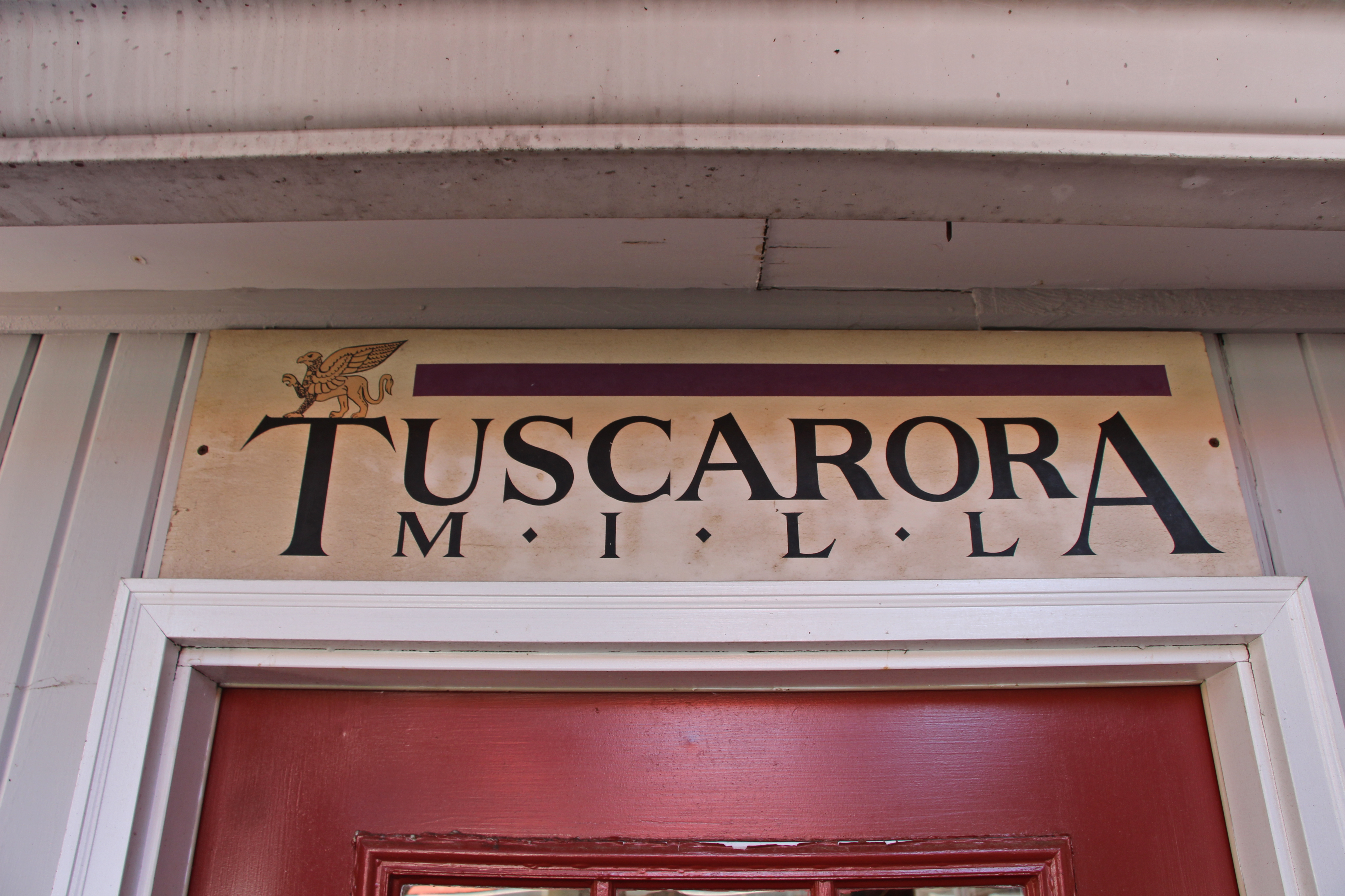 The griffin-marked sign of Tuscarora Mill, another of Loudoun’s preserved industrial landmarks.