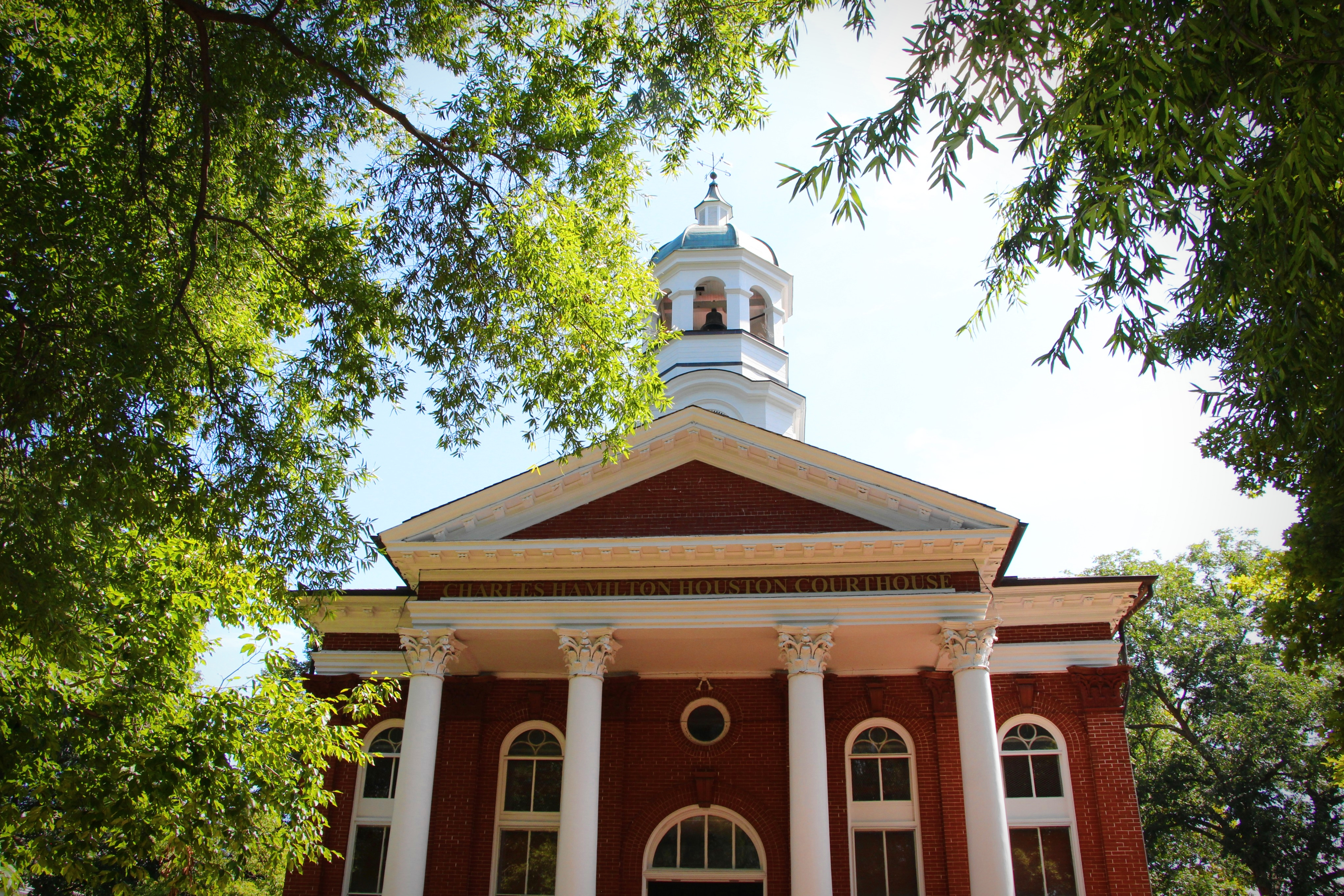 The Charles Hamilton Houston Courthouse — classical brick columns that have watched over Loudoun’s public life for generations.