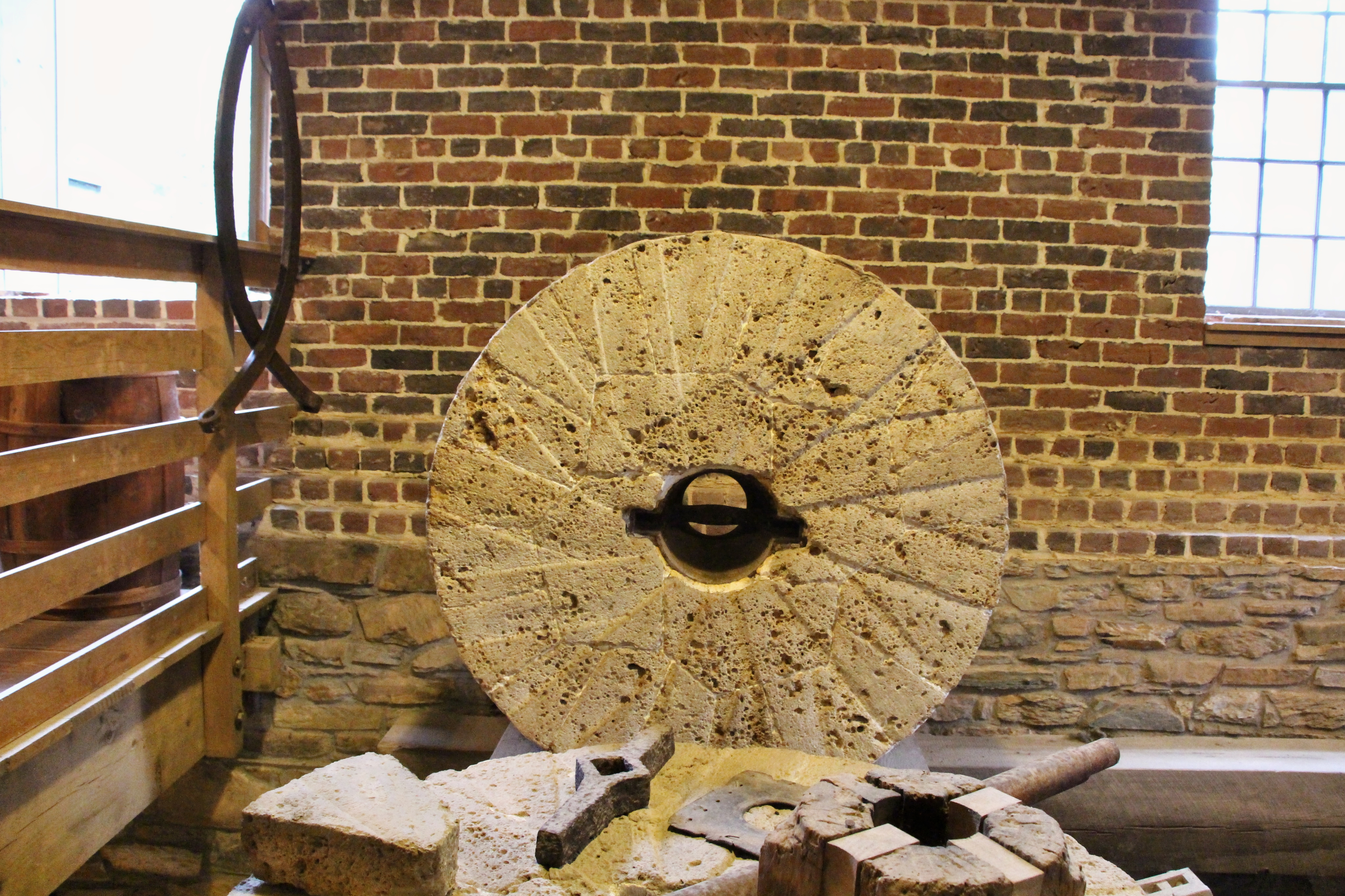 A millstone, grooved and patient, where the county’s grain was reduced to flour.