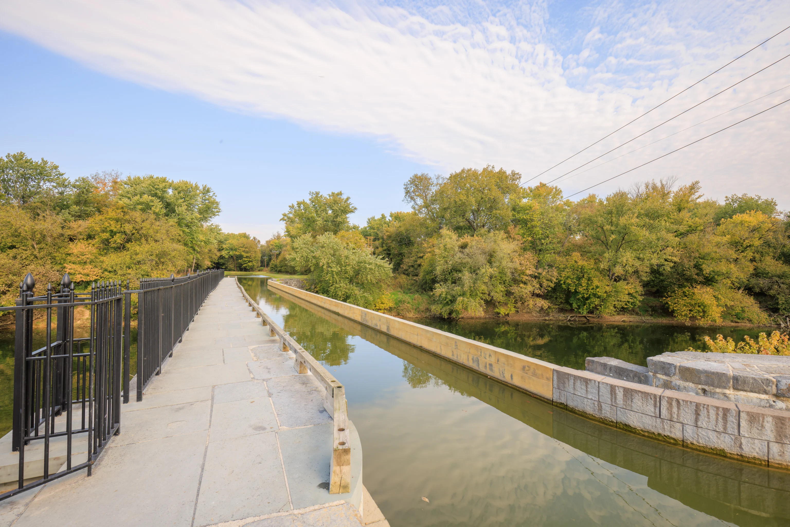 The aqueduct today — the towpath beside the rewatered channel, walked by visitors in place of the mules that once drew the barges.