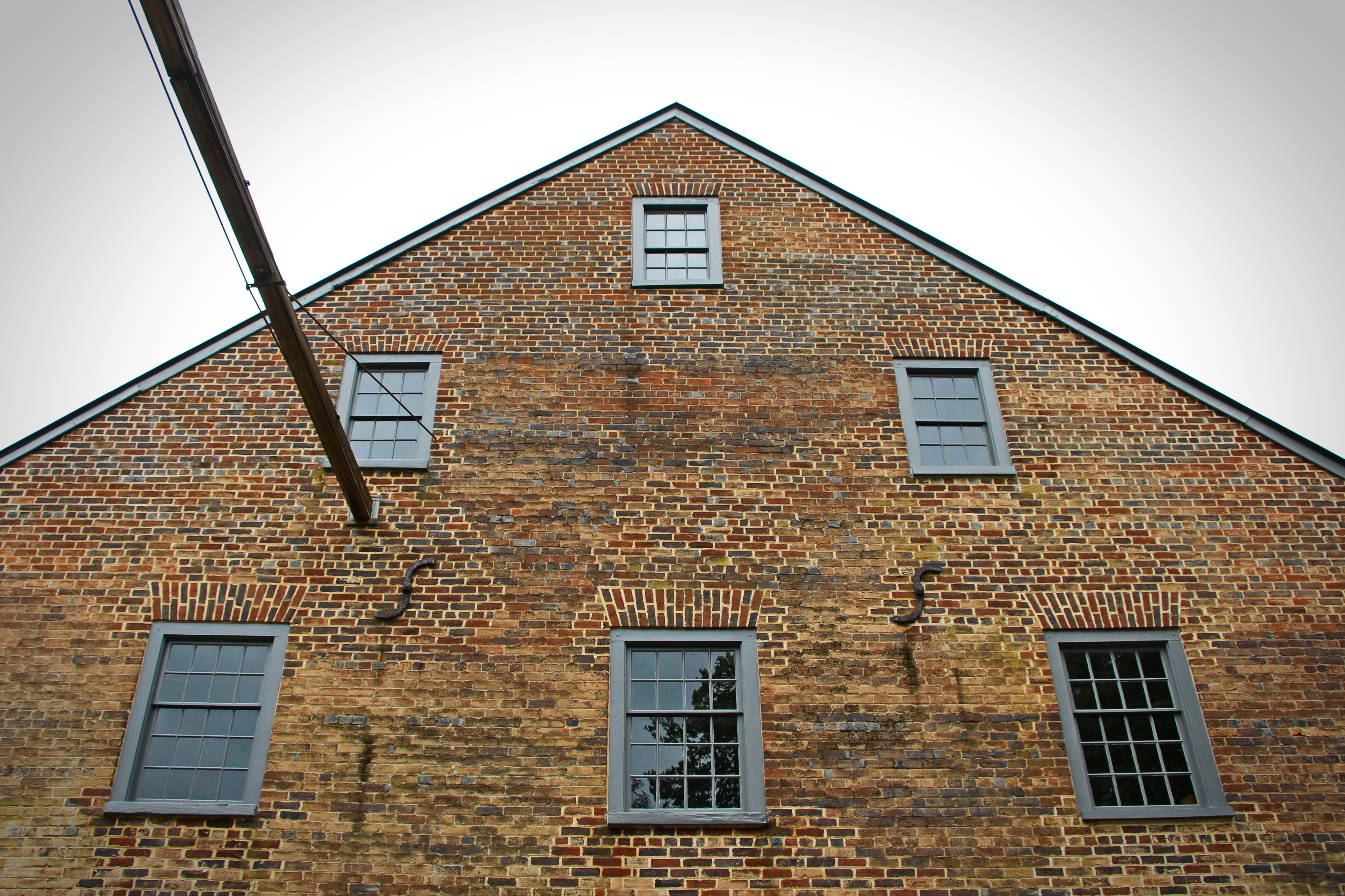 The brick gable of Aldie Mill, weathered by two centuries of Loudoun weather.