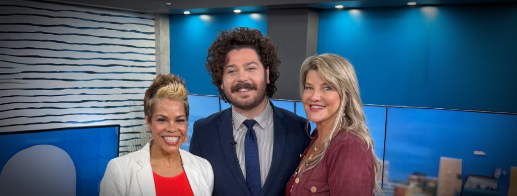 Sharon Virts with studio hosts on the Between the Lines set