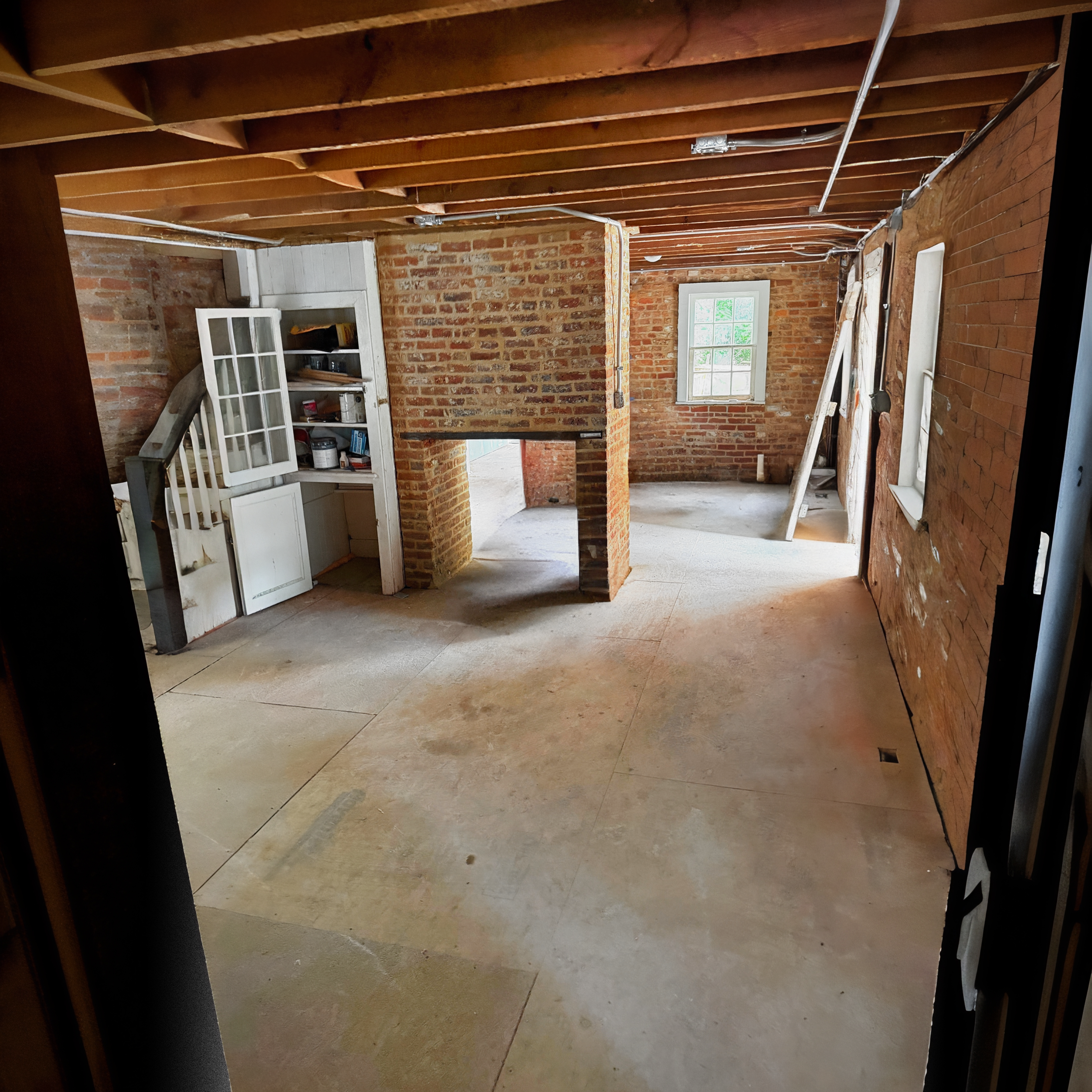 Whitmore properties — interior with brick chimney