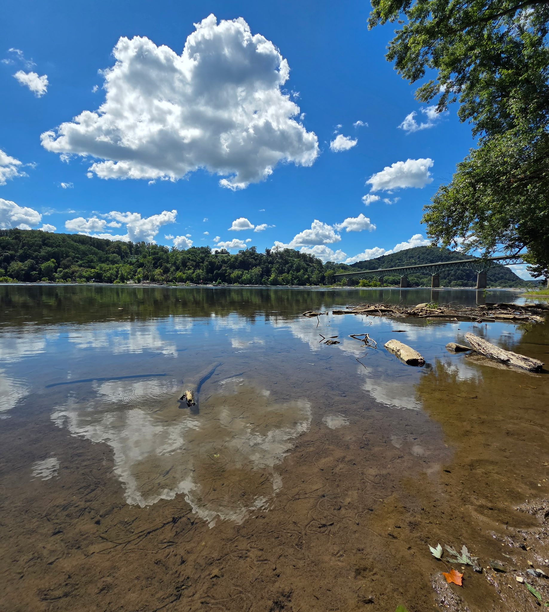 The Potomac at Harpers Ferry — shallow, clear, and mirroring the sky above the very hills the series’ characters would have ridden past.
