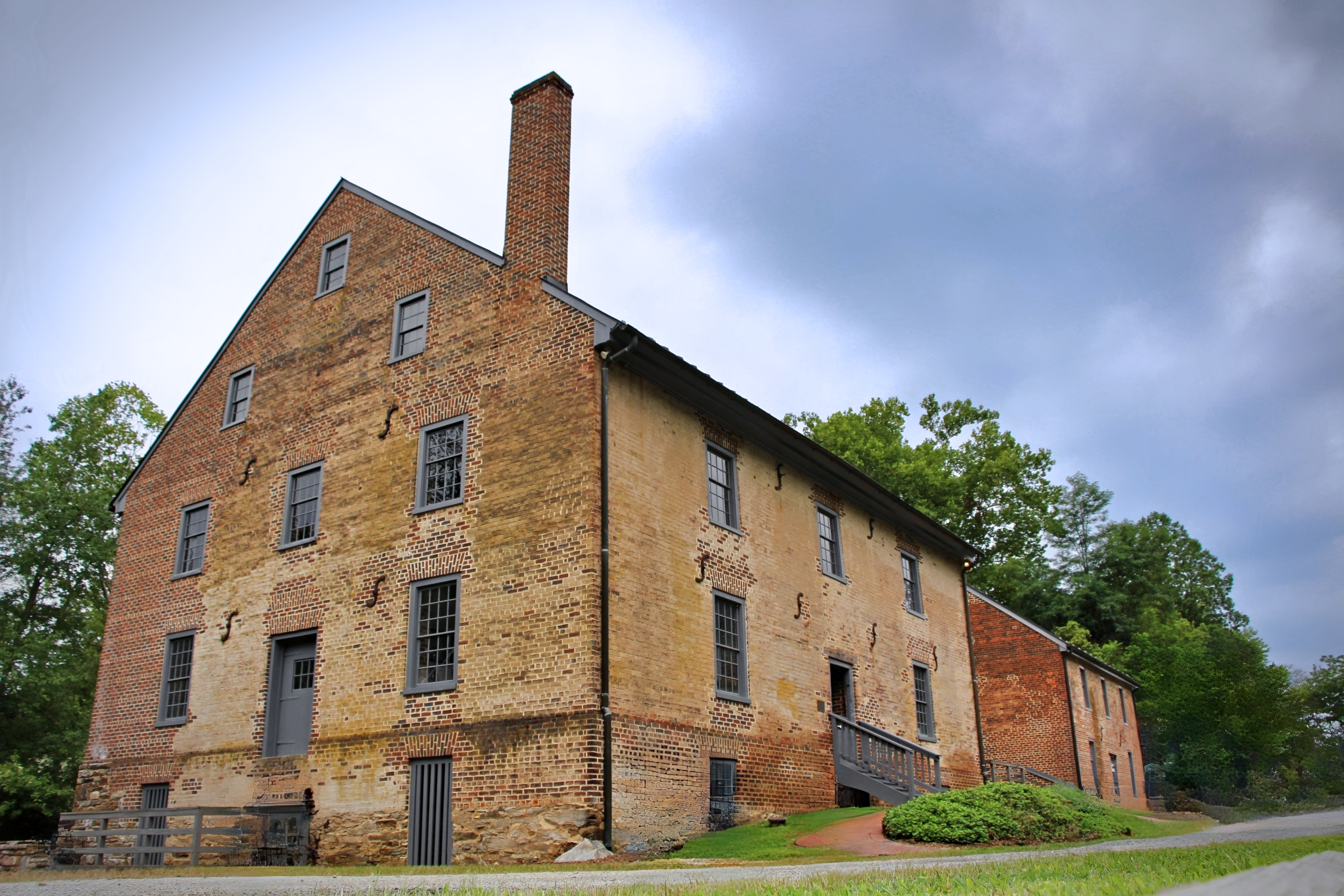 Aldie Mill — a four-story brick grist mill on the Little River, still standing on its original foundations.