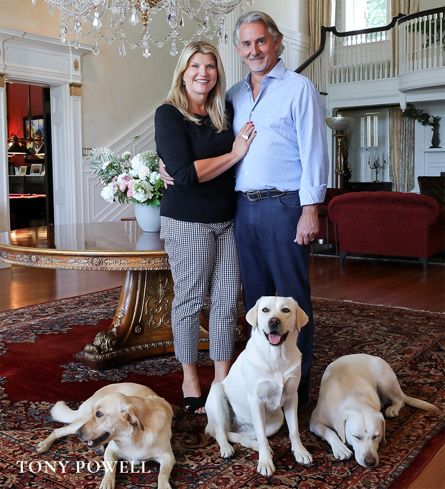 Sharon Virts and Scott Miller with their three Labrador retrievers at home