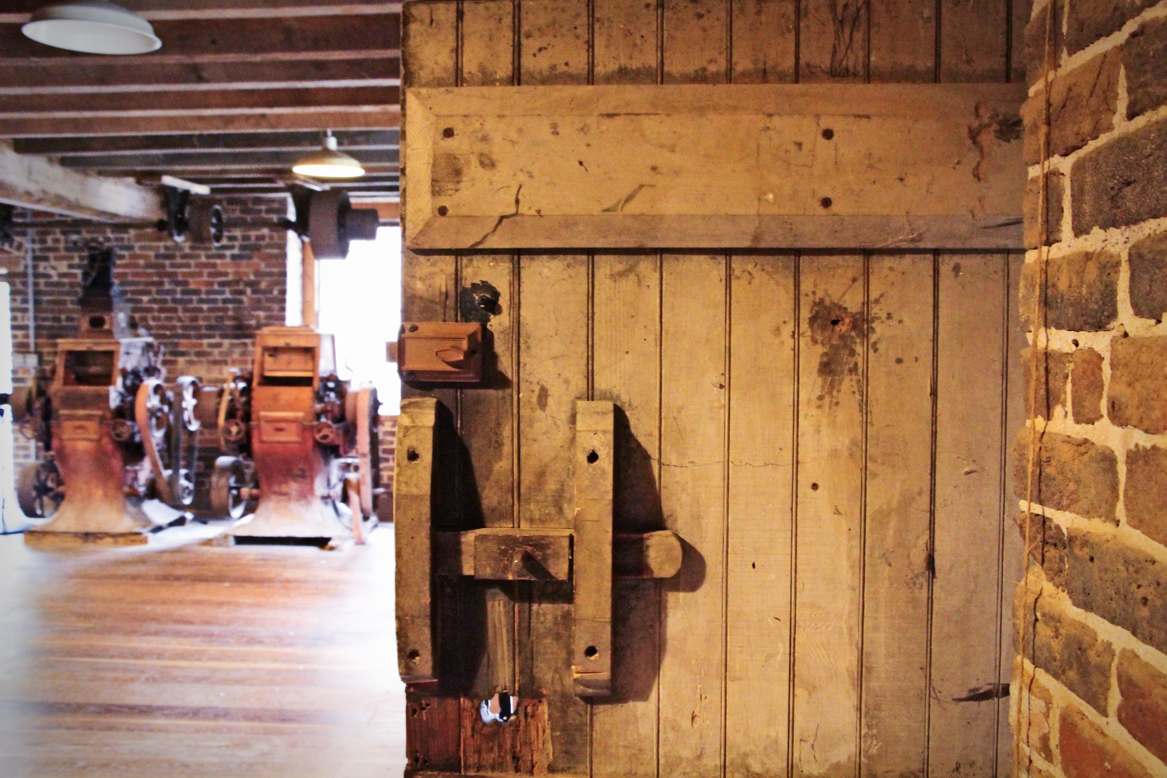 A threshold into the mill’s working interior — the doorway the millers themselves would have used.