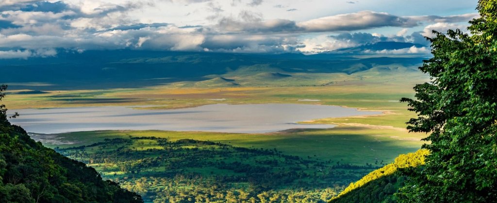 Ngorongoro Crater floor with flamingos at the lake