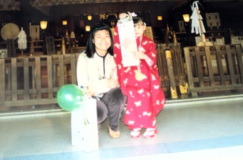 Hannah as a child at a Japanese shrine