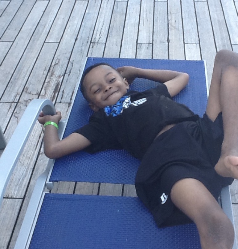 Nick at age 8 on a cruise ship deck