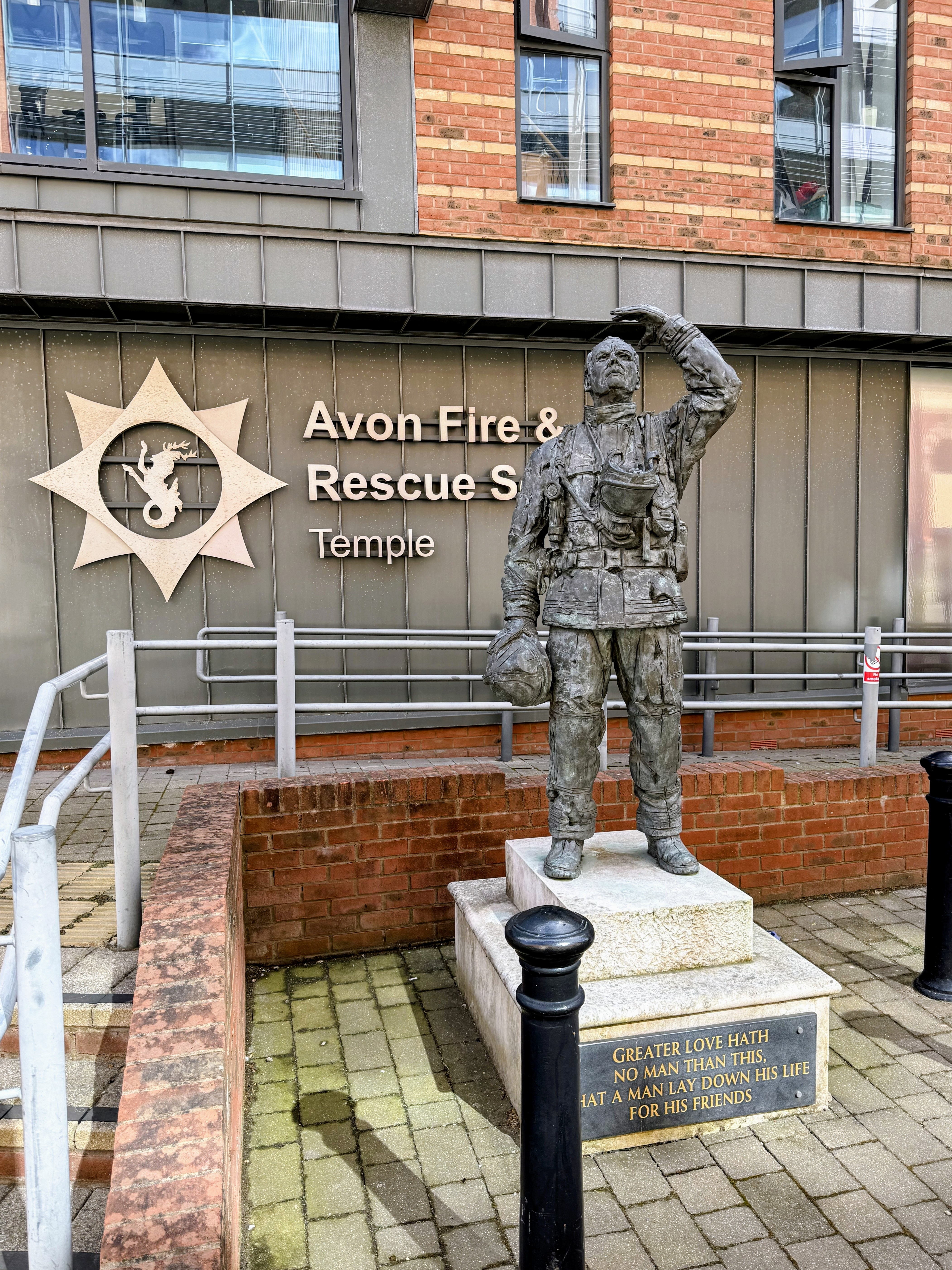 The bronze memorial statue of a firefighter outside Temple Fire Station