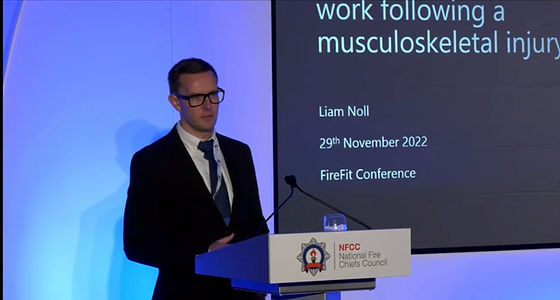 Dr Liam Noll speaking at the FireFit Conference