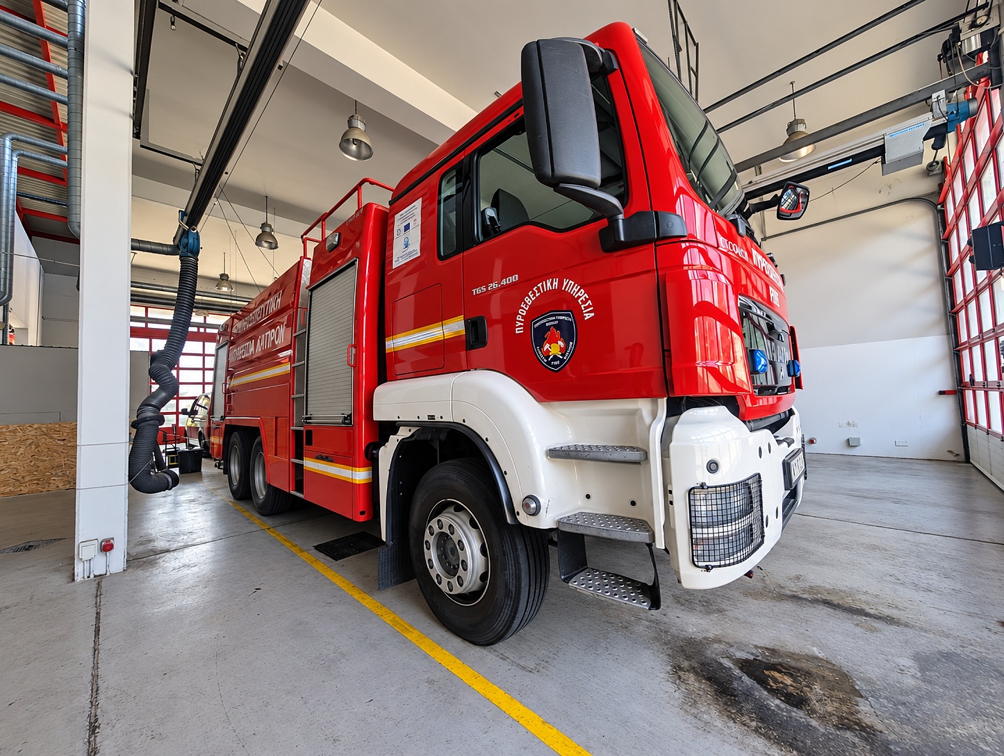 The MAN TGS 26.400 water carrier — accompanies the first pump to structure fires and carries a monitor.